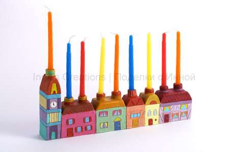 \"houses-hanukiah-with-candle\"